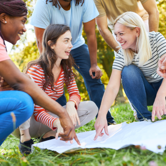 Photograph of a group gathered around a map