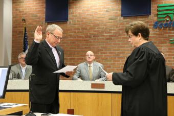 Swearing in Supervisor Brinson L. Kinzer.