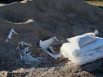 Sand and empty sandbags.