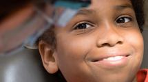 Child receiving dental screening