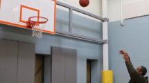 Harlee Miller shoots a basketball.